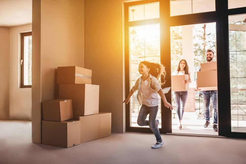 Steps To Owning a McNaughton New Home 57 Steps To Own 09 Family With Cardboard Boxes Moving Into A New Home
